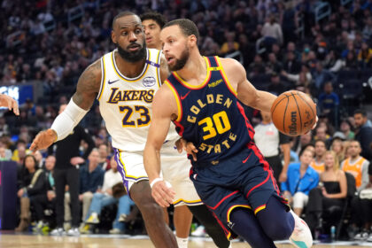 Jan 25, 2025; San Francisco, California, USA; Golden State Warriors guard Stephen Curry (30) dribbles against Los Angeles Lakers forward LeBron James (23) during the third quarter at Chase Center. Mandatory Credit: Darren Yamashita-Imagn Images