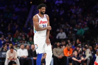 Philadelphia, Pennsylvania, USA; Philadelphia 76ers center Joel Embiid (21) holds his arm after falling against the Toronto Raptors in the second quarter at Wells Fargo Center. Mandatory Credit: Kyle Ross-Imagn Images