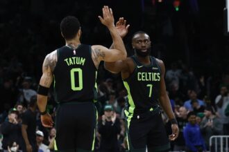 Feb 28, 2025; Boston, Massachusetts, USA; Boston Celtics guard Jaylen Brown (7) high fives forward Jayson Tatum (0) after the Cleveland Cavaliers called a timeout during the first quarter at TD Garden. Mandatory Credit: Winslow Townson-Imagn Images