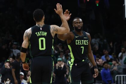 Feb 28, 2025; Boston, Massachusetts, USA; Boston Celtics guard Jaylen Brown (7) high fives forward Jayson Tatum (0) after the Cleveland Cavaliers called a timeout during the first quarter at TD Garden. Mandatory Credit: Winslow Townson-Imagn Images