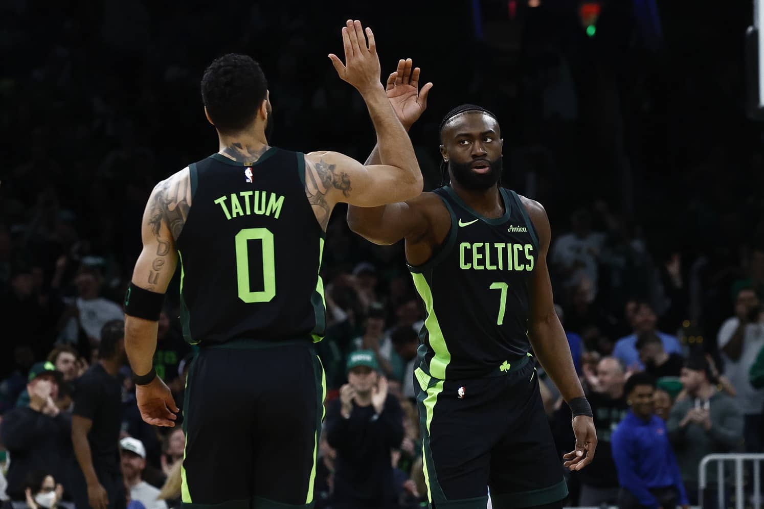 Feb 28, 2025; Boston, Massachusetts, USA; Boston Celtics guard Jaylen Brown (7) high fives forward Jayson Tatum (0) after the Cleveland Cavaliers called a timeout during the first quarter at TD Garden. Mandatory Credit: Winslow Townson-Imagn Images