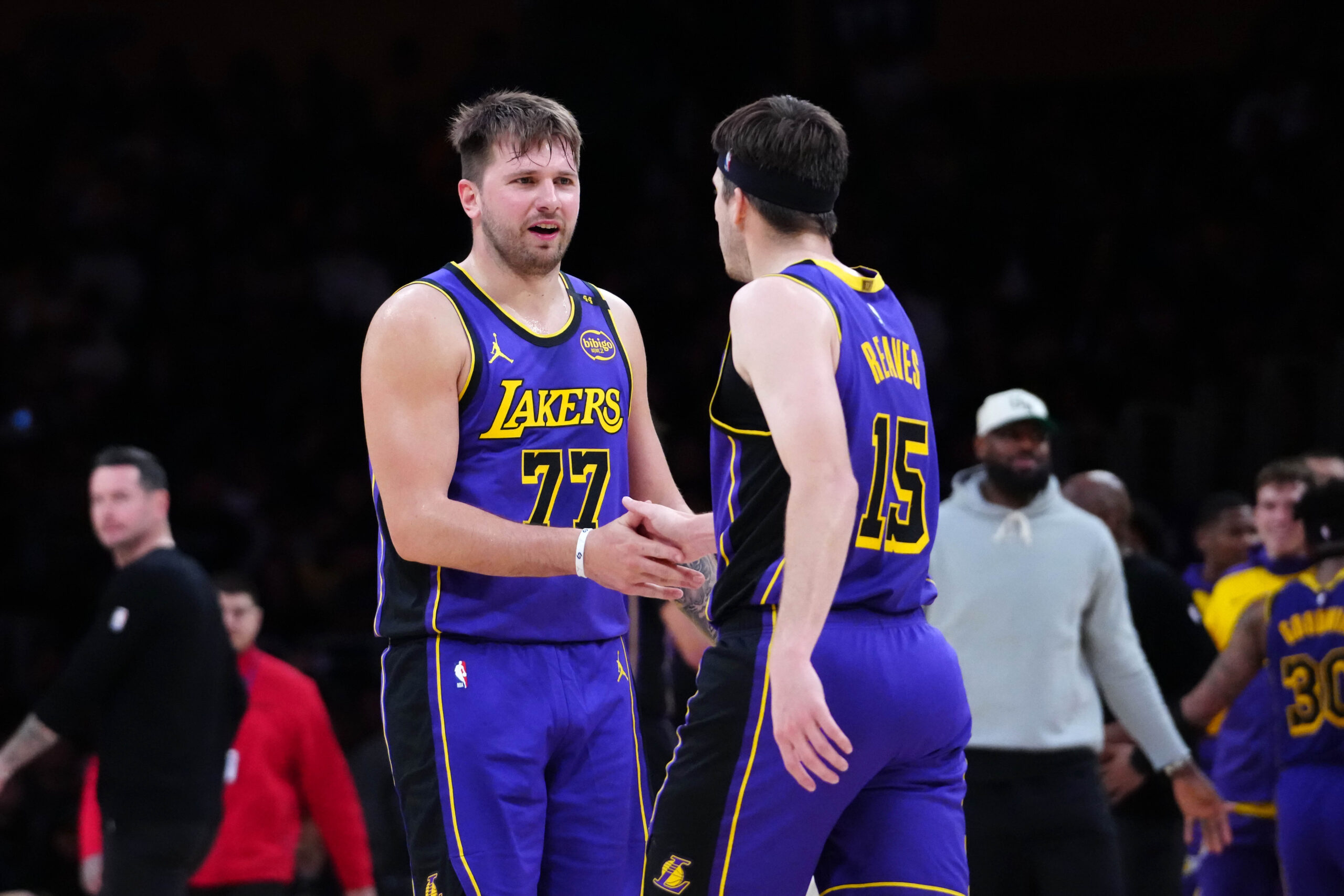 Mar 17, 2025; Los Angeles, California, USA; Los Angeles Lakers guard Luka Doncic (77) and guard Austin Reaves (15) react against the San Antonio Spurs in the first half at Crypto.com Arena. Mandatory Credit: Kirby Lee-Imagn Images