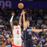 Mar 19, 2025; Orlando, Florida, USA; Houston Rockets guard Jalen Green (4) shoots against Orlando Magic forward Franz Wagner (22) during the first quarter at Kia Center. Mandatory Credit: Mike Watters-Imagn Images