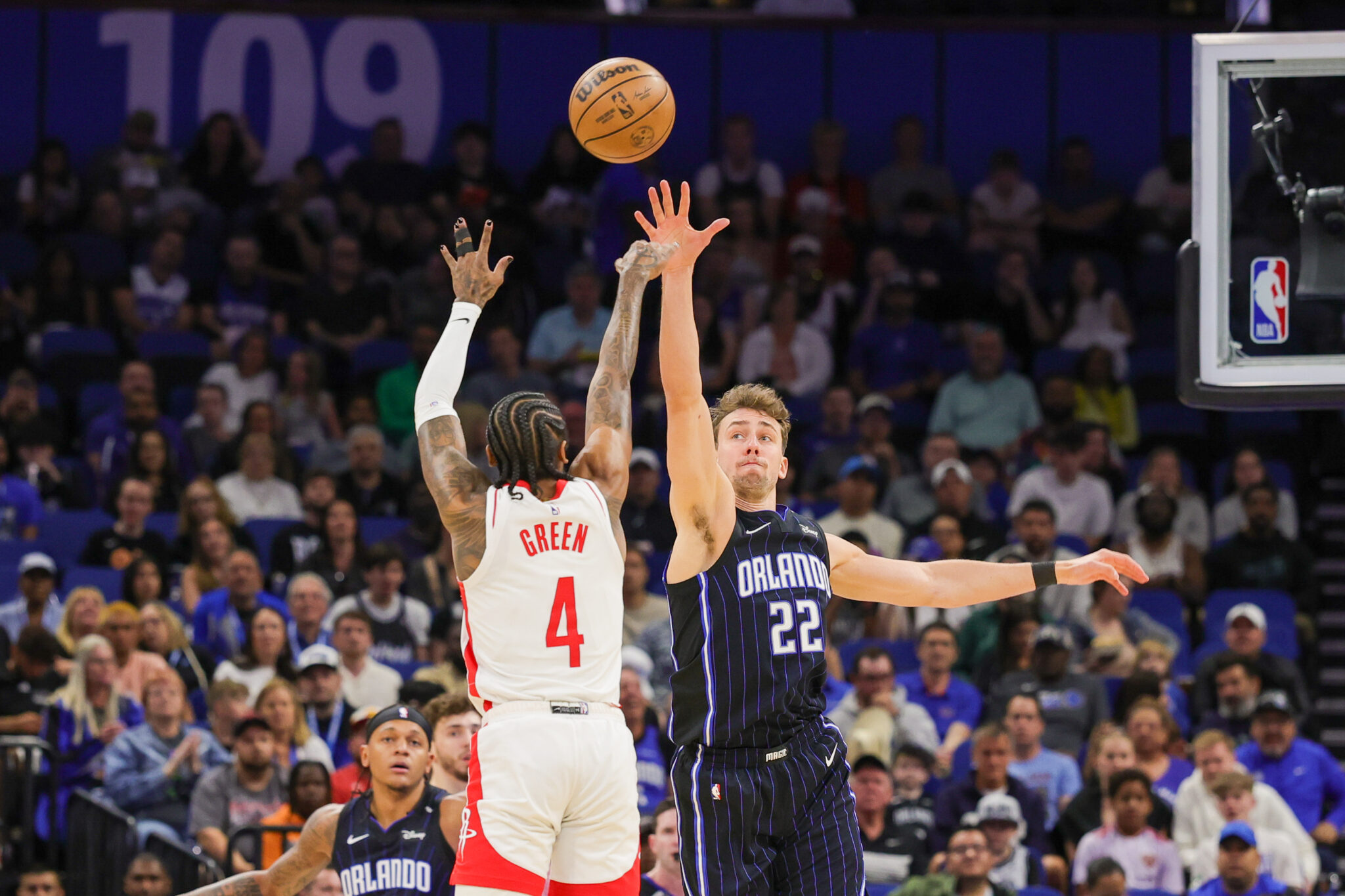 Mar 19, 2025; Orlando, Florida, USA; Houston Rockets guard Jalen Green (4) shoots against Orlando Magic forward Franz Wagner (22) during the first quarter at Kia Center. Mandatory Credit: Mike Watters-Imagn Images