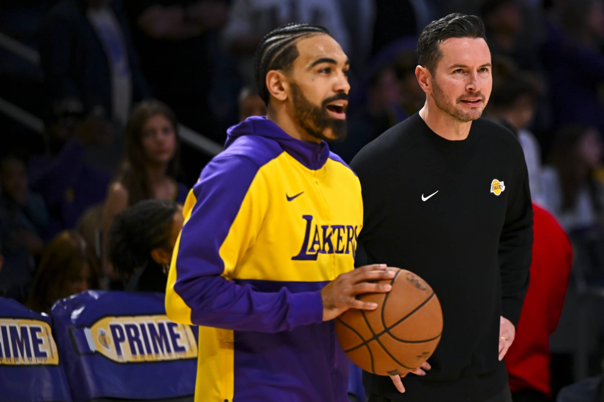 Mar 20, 2025; Los Angeles, California, USA; Los Angeles Lakers guard Gabe Vincent (7) talks with Los Angeles Lakers head coach JJ Redick before the game against the Milwaukee Bucksat Crypto.com Arena. Mandatory Credit: Jonathan Hui-Imagn Images
