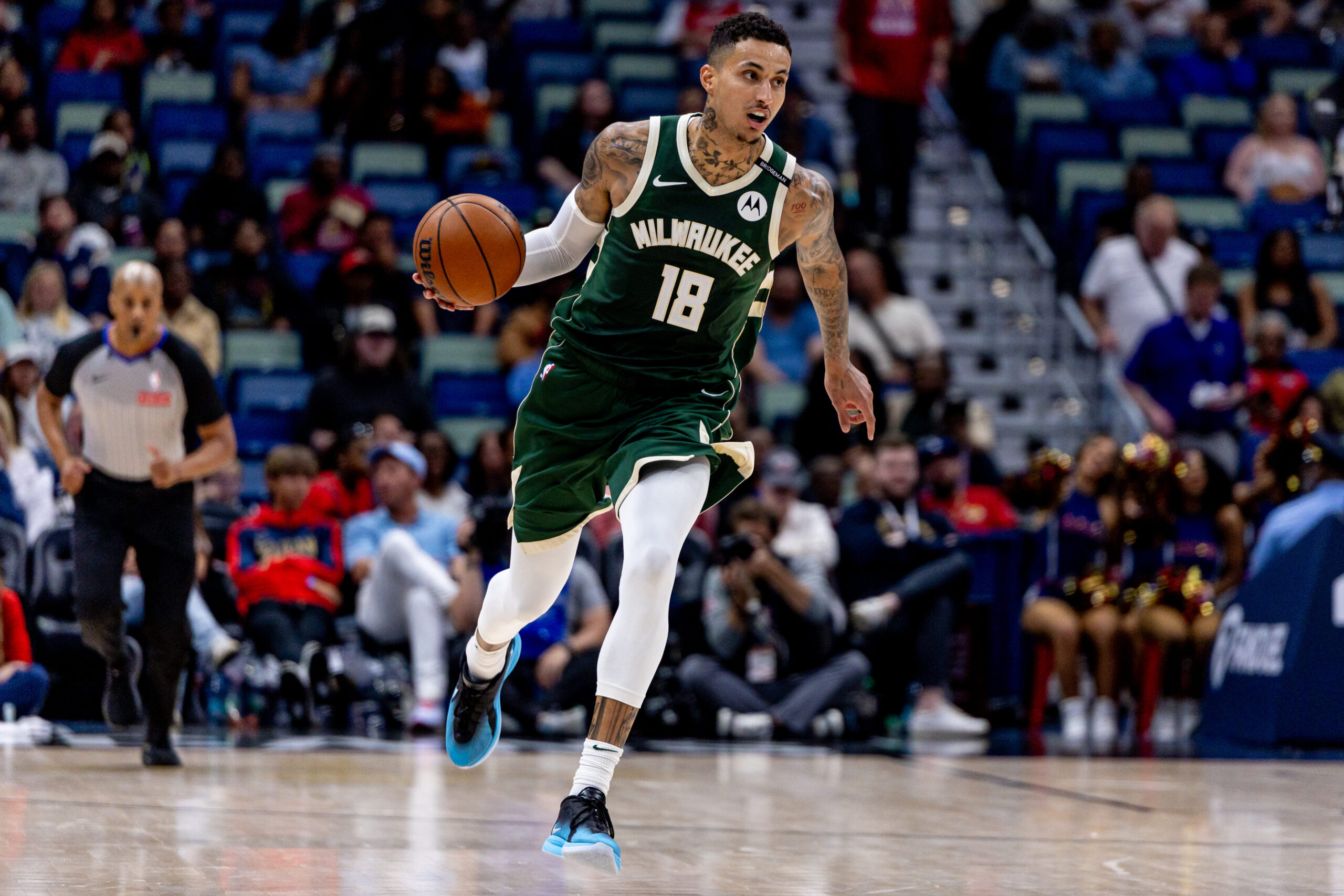 Apr 6, 2025; New Orleans, Louisiana, USA; Milwaukee Bucks forward Kyle Kuzma (18) brings the ball up court against the New Orleans Pelicans during the first half at Smoothie King Center. Mandatory Credit: Stephen Lew-Imagn Images