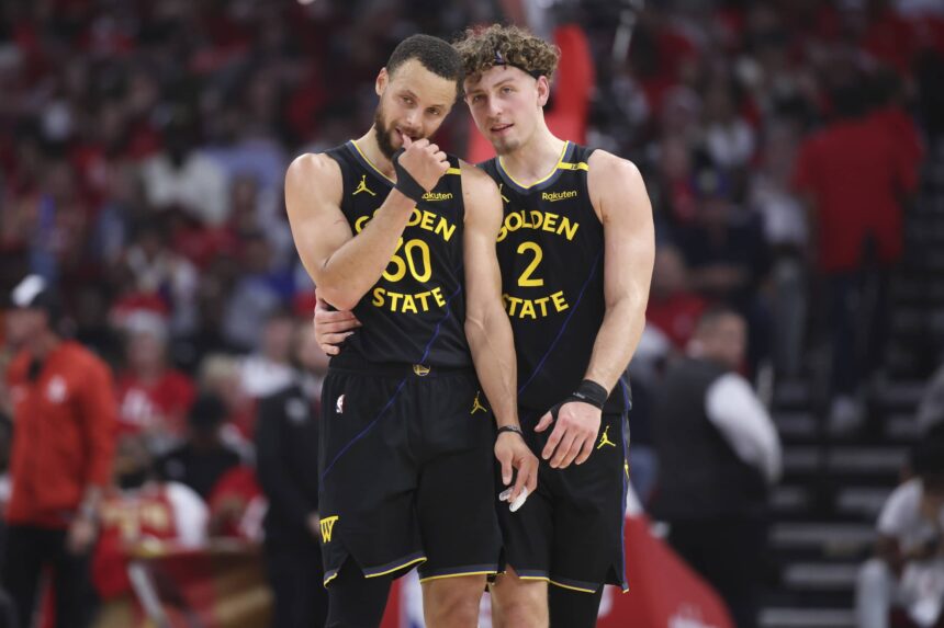 May 4, 2025; Houston, Texas, USA; Golden State Warriors guard Stephen Curry (30) and guard Brandin Podziemski (2) talk during a timeout during game seven of first round for the 2025 NBA Playoffs against the Houston Rockets at Toyota Center. Mandatory Credit: Troy Taormina-Imagn Images