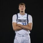 Sep 29, 2025; Dallas, TX, USA; Dallas Mavericks forward Cooper Flagg (32) poses for a photo during the Mavericks 2025 media day at the American Airlines Center. Mandatory Credit: Jerome Miron-Imagn Images