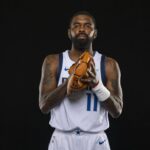 Sep 29, 2025; Dallas, TX, USA; Dallas Mavericks guard Kyrie Irving (11) poses for a photo during the Mavericks 2025 media day at the American Airlines Center. Mandatory Credit: Jerome Miron-Imagn Images