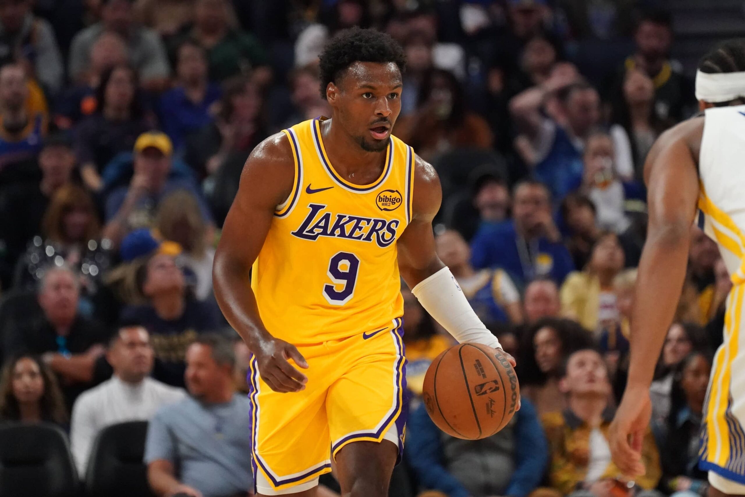 San Francisco, California, USA; Los Angeles Lakers guard Bronny James (9) dribbles upcourt against the Golden State Warriors in the second quarter at Chase Center. Mandatory Credit: David Gonzales-Imagn Images