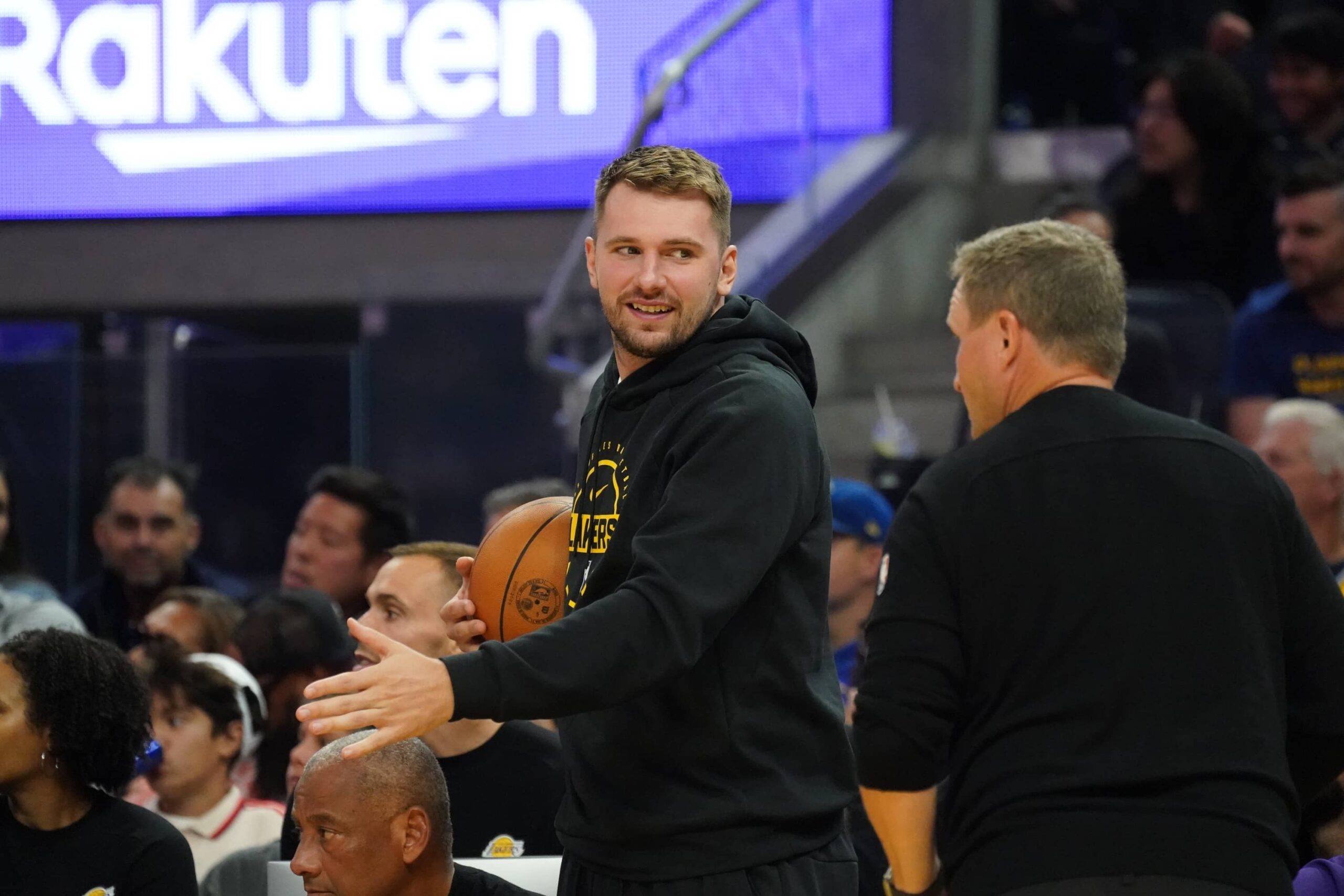 Oct 5, 2025; San Francisco, California, USA; Los Angeles Lakers forward/guard Luka Doncic (77) watches the action from the bench during a game against the Golden State Warriors in the second quarter at Chase Center. Mandatory Credit: David Gonzales-Imagn Images
