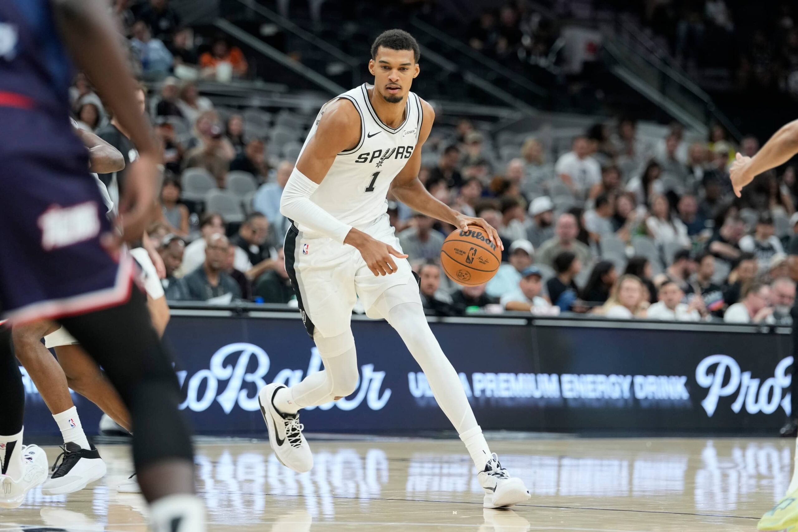 Oct 6, 2025; San Antonio, TX, USA; San Antonio Spurs forward-center Victor Wembanyama (1) drives to the basket during the first half against the Guangzhou Loong Lions at Frost Bank Center. Mandatory Credit: Scott Wachter-Imagn Images