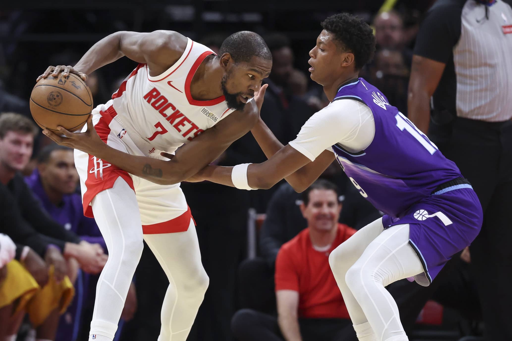 Oct 8, 2025; Houston, Texas, USA; Houston Rockets forward Kevin Durant (7) controls the ball as Utah Jazz forward Ace Bailey (19) defends during the second quarter at Toyota Center. Mandatory Credit: Troy Taormina-Imagn Images
