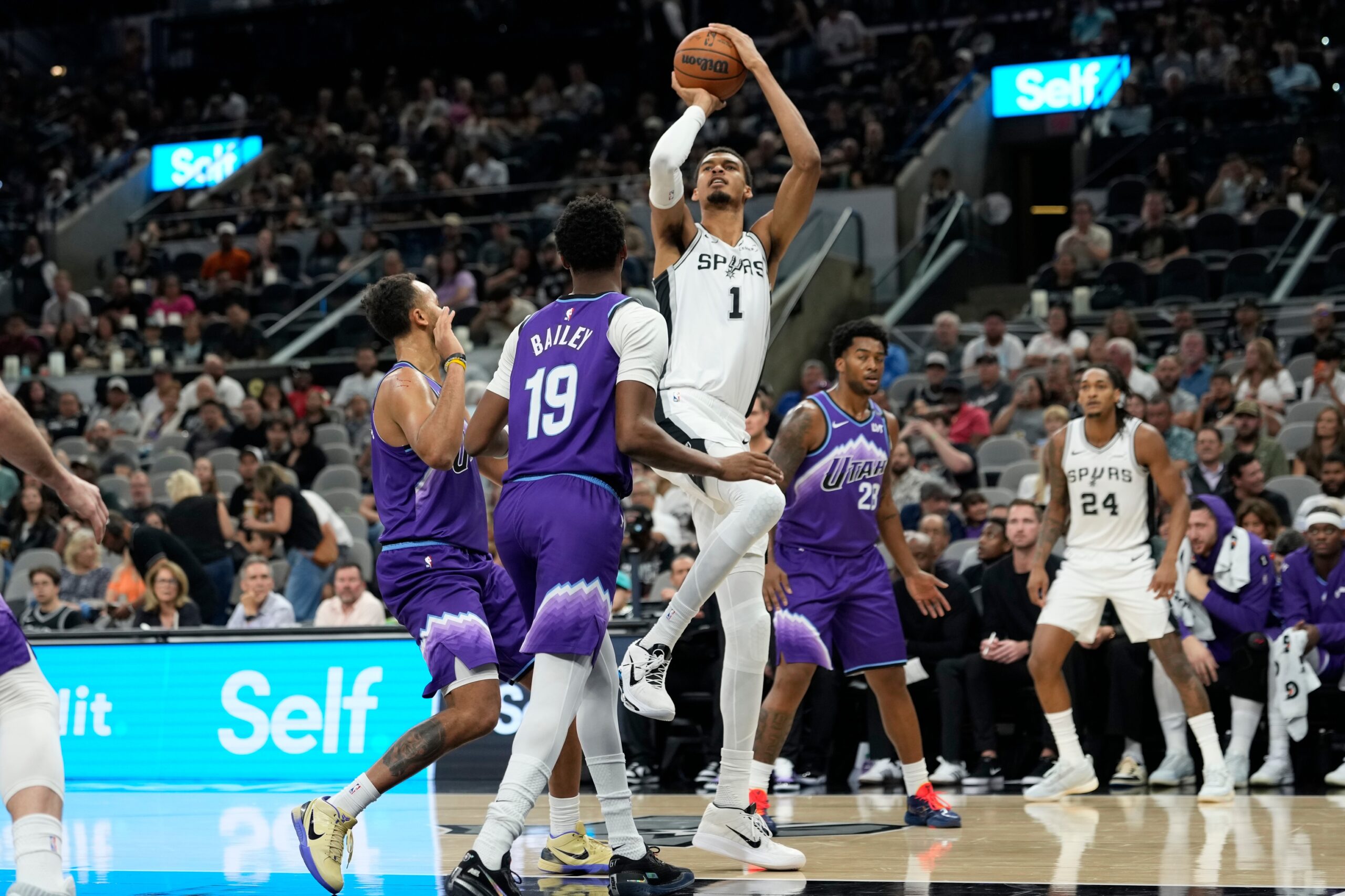 Oct 10, 2025; San Antonio, Texas, USA; San Antonio Spurs forward Victor Wembanyama (1) shoots over Utah Jazz forward forward Kyle Anderson (0) and guard Ace Bailey (19) during the first half at Frost Bank Center. Mandatory Credit: Scott Wachter-Imagn Images