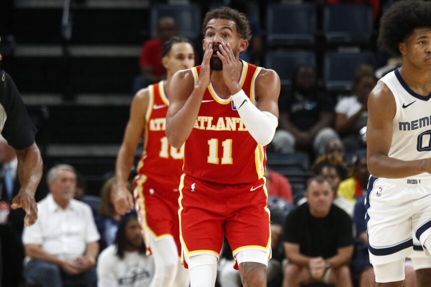 Atlanta Hawks guard Trae Young (11) reacts during the third quarter against the Memphis Grizzlies at FedExForum. Mandatory Credit: Petre Thomas-Imagn Images