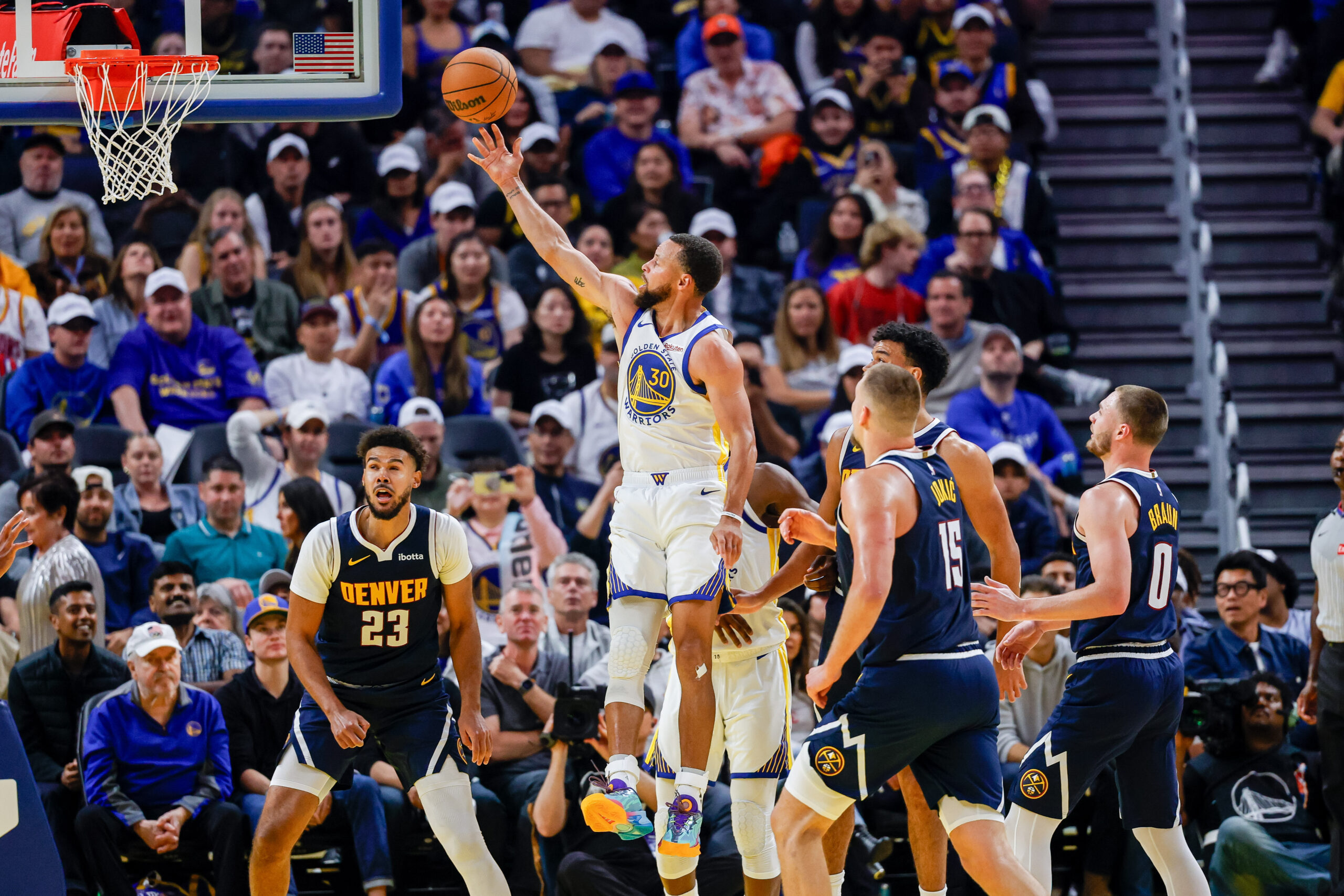 Oct 23, 2025; San Francisco, California, USA; Golden State Warriors guard Stephen Curry (30) puts up a shot against the Denver Nuggets during the second quarter at Chase Center. Mandatory Credit: Bob Kupbens-Imagn Images