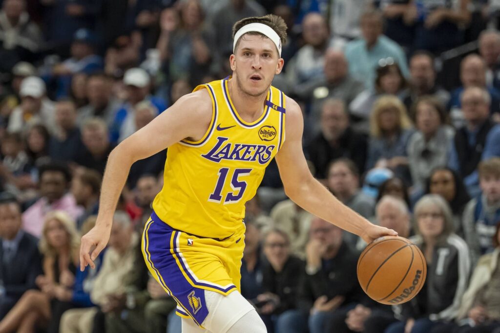 Los Angeles Lakers guard Austin Reaves (15) dribbles the ball against the Minnesota Timberwolves during Game 3 of the first round of the 2024 NBA Playoffs at Target Center.