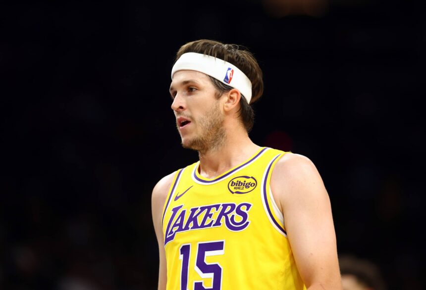 Phoenix, Arizona, USA; Los Angeles Lakers guard Austin Reaves (15) against the Phoenix Suns during an NBA preseason game at Mortgage Matchup Center. Mandatory Credit: Mark J. Rebilas-Imagn Images