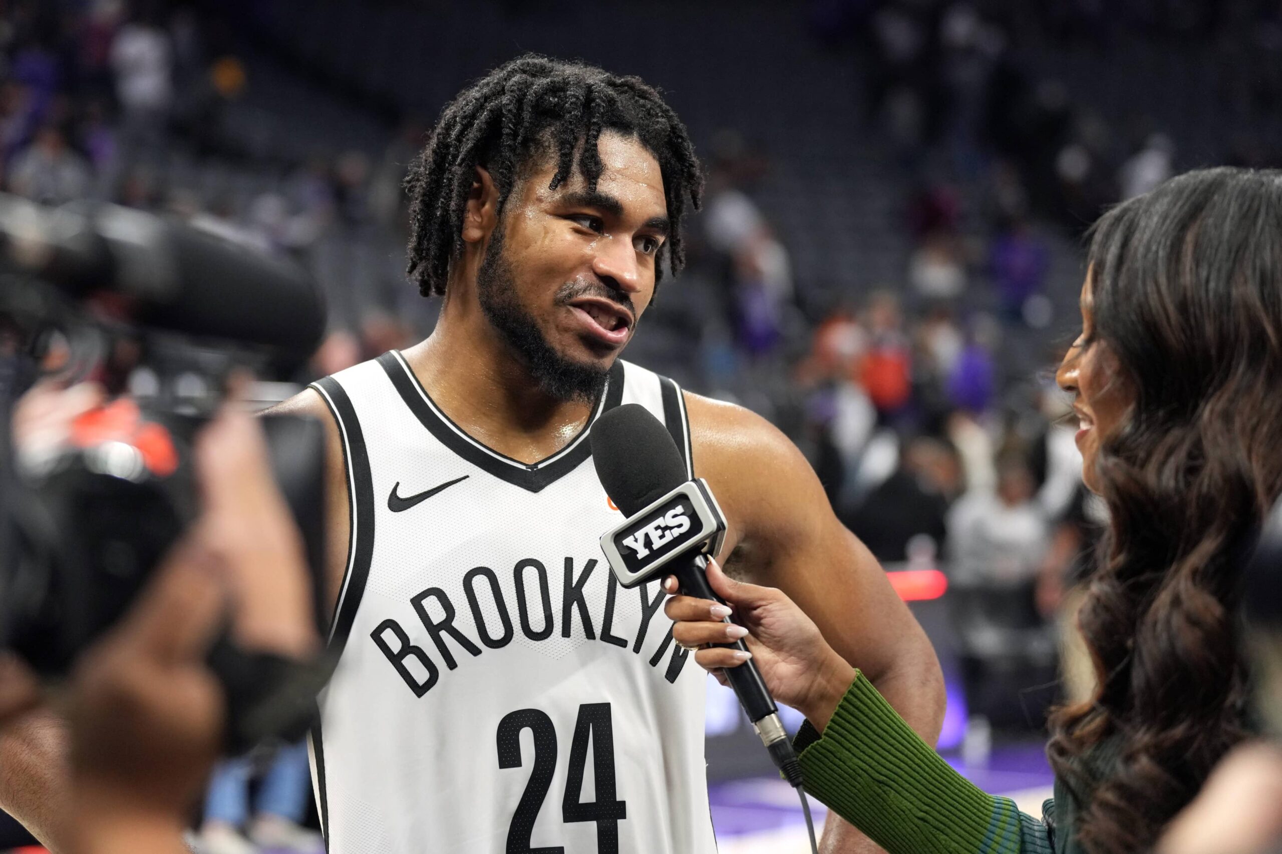 Sacramento, California, USA; Brooklyn Nets guard Cam Thomas (24) is interviewed after defeating the Sacramento Kings at Golden 1 Center. Mandatory Credit: Darren Yamashita-Imagn Images