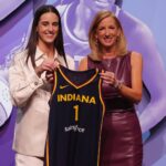 Brooklyn, NY, USA; Caitlin Clark poses with WNBA commissioner Cathy Engelbert after she is selected with the number one overall pick to the Indiana Fever in the 2024 WNBA Draft at Brooklyn Academy of Music. Mandatory Credit: Brad Penner-Imagn Images