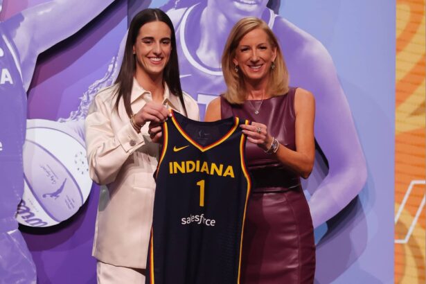 Brooklyn, NY, USA; Caitlin Clark poses with WNBA commissioner Cathy Engelbert after she is selected with the number one overall pick to the Indiana Fever in the 2024 WNBA Draft at Brooklyn Academy of Music. Mandatory Credit: Brad Penner-Imagn Images