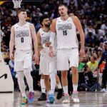 Denver, Colorado, USA; Denver Nuggets guard Jamal Murray (27), center Nikola Jokic (15) and guard Christian Braun (0) in the fourth quarter against the Oklahoma City Thunder during Game 6 of the second round of the 2025 NBA Playoffs at Ball Arena. Mandatory Credit: Isaiah J. Downing-Imagn Images