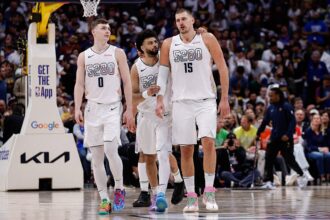 Denver, Colorado, USA; Denver Nuggets guard Jamal Murray (27), center Nikola Jokic (15) and guard Christian Braun (0) in the fourth quarter against the Oklahoma City Thunder during Game 6 of the second round of the 2025 NBA Playoffs at Ball Arena. Mandatory Credit: Isaiah J. Downing-Imagn Images