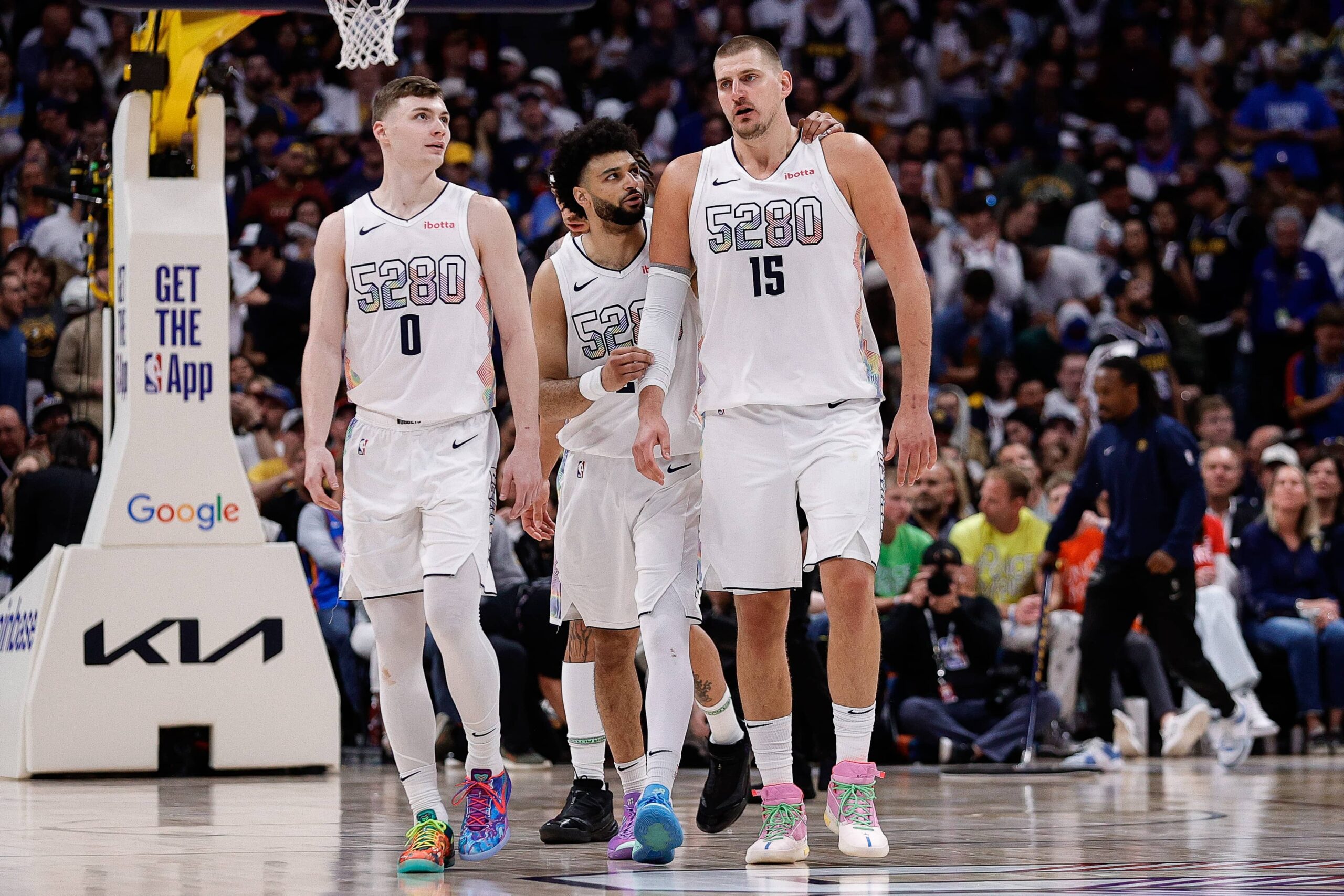 Denver, Colorado, USA; Denver Nuggets guard Jamal Murray (27), center Nikola Jokic (15) and guard Christian Braun (0) in the fourth quarter against the Oklahoma City Thunder during Game 6 of the second round of the 2025 NBA Playoffs at Ball Arena. Mandatory Credit: Isaiah J. Downing-Imagn Images