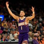 Phoenix, Arizona, USA; Phoenix Suns guard Devin Booker (1) reacts against the Golden State Warriors at Footprint Center. Mandatory Credit: Mark J. Rebilas-Imagn Images