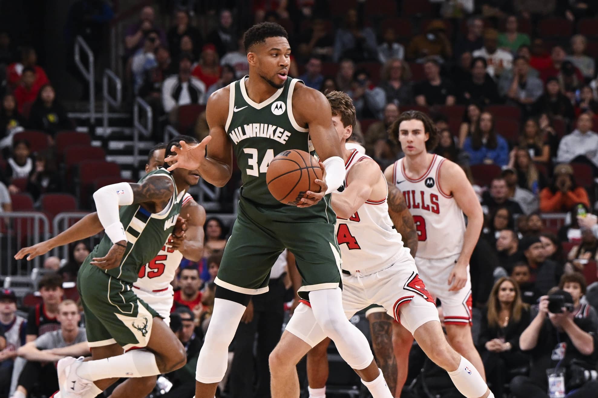 Chicago, Illinois, USA; Milwaukee Bucks forward Giannis Antetokounmpo (34) grabs the ball against the Chicago Bulls during the first half at the United Center. Mandatory Credit: Matt Marton-Imagn Images