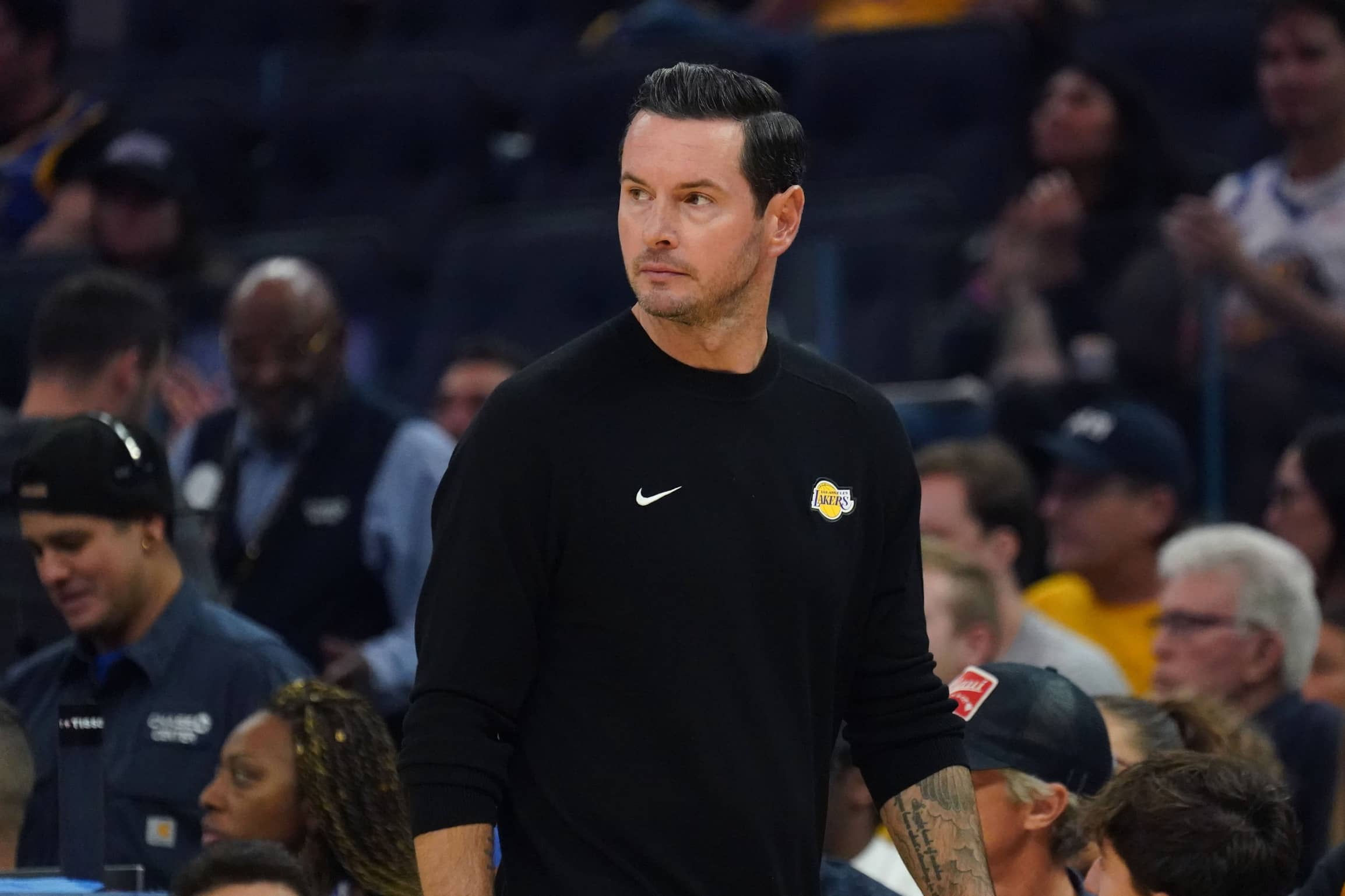 San Francisco, California, USA; Los Angeles Lakers head coach JJ Redick watches the action against the Golden State Warriors in the first quarter at Chase Center. Mandatory Credit: David Gonzales-Imagn Images
