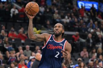 Inglewood, California, USA; Los Angeles Clippers forward Kawhi Leonard (2) stole the ball from Phoenix Suns guard Collin Gillespie (12) and went down court for a basket in the first half at Intuit Dome. Mandatory Credit: Jayne Kamin-Oncea-Imagn Images