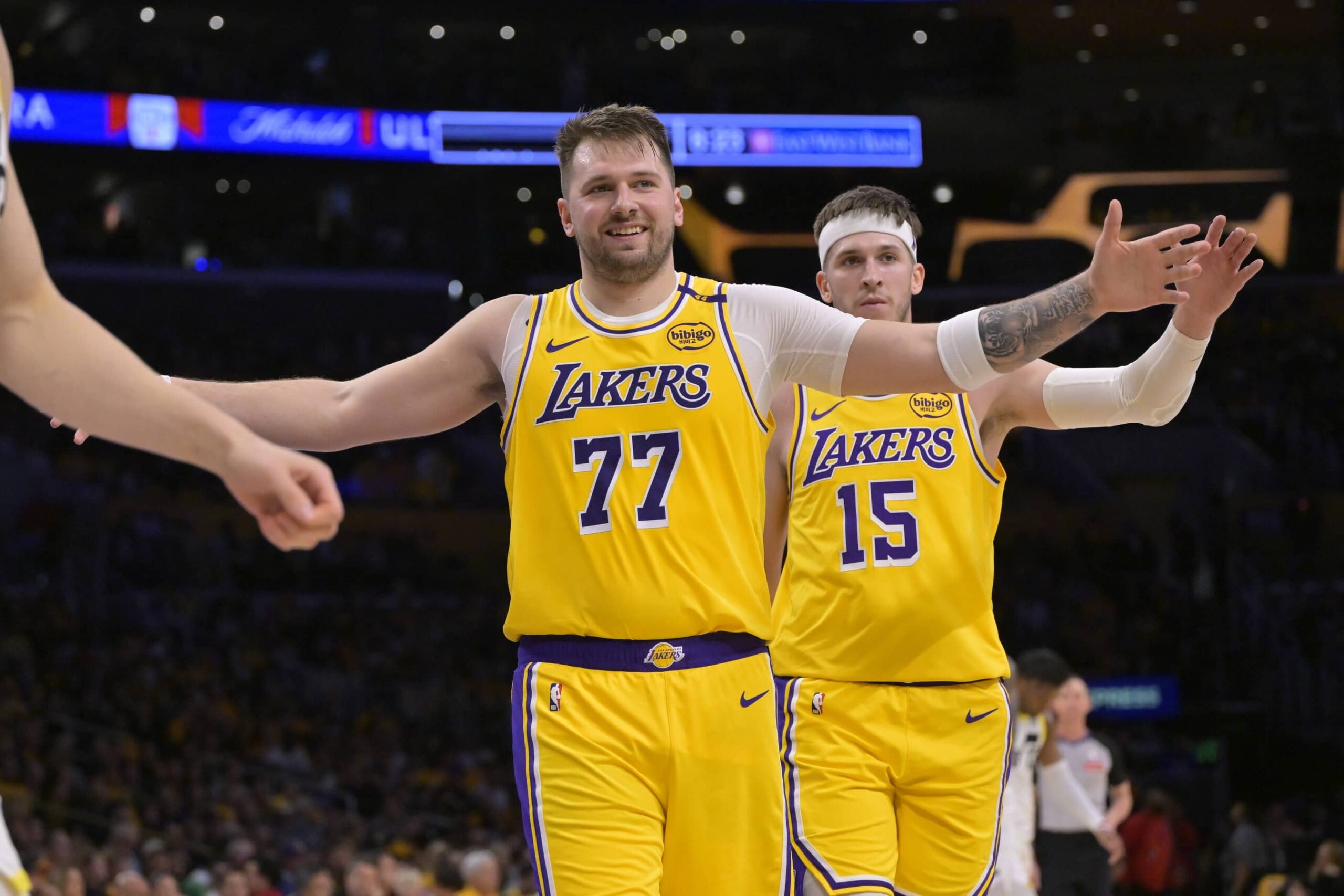 Los Angeles, California, USA; Los Angeles Lakers guard Luka Doncic (77) and guard Austin Reaves (15) react after a basket against the Utah Jazz at Crypto.com Arena. Mandatory Credit: Jayne Kamin-Oncea-Imagn Images