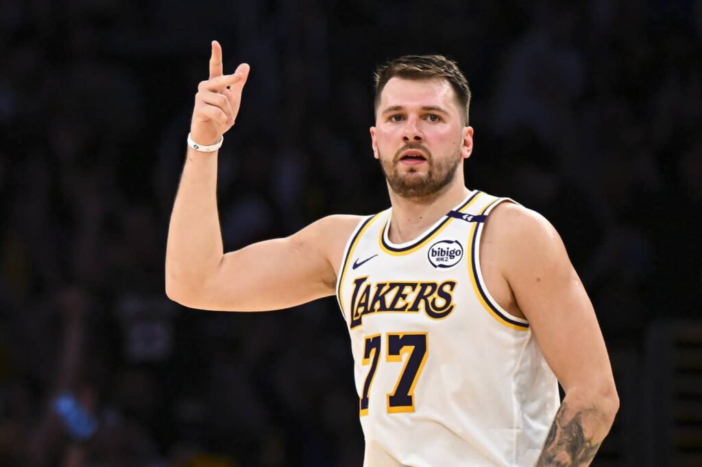 Los Angeles, California, USA; Los Angeles Lakers guard Luka Doncic (77) reacts after scoring against Chicago Bulls during the first half at Crypto.com Arena. Mandatory Credit: Jonathan Hui-Imagn Images