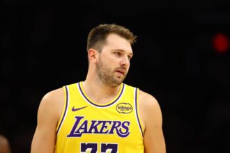 Phoenix, Arizona, USA; Los Angeles Lakers guard Luka Doncic (77) against the Phoenix Suns during an NBA preseason game at Mortgage Matchup Center. Mandatory Credit: Mark J. Rebilas-Imagn Images