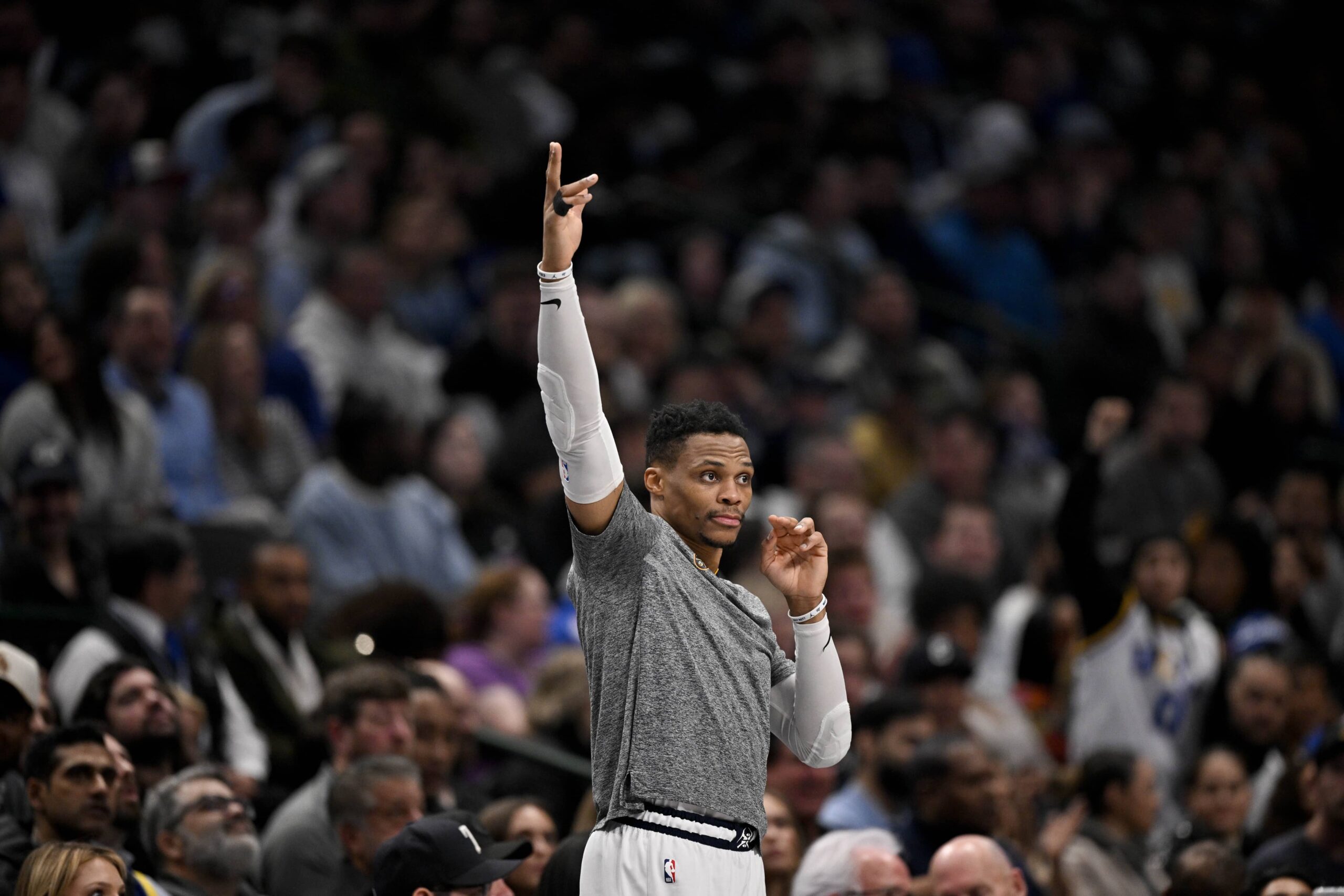 Dallas, Texas, USA; Russell Westbrook celebrates after Denver Nuggets center Nikola Jokic (not pictured) makes a three-point basket against the Dallas Mavericks during the second quarter at the American Airlines Center. Mandatory Credit: Jerome Miron-Imagn Images