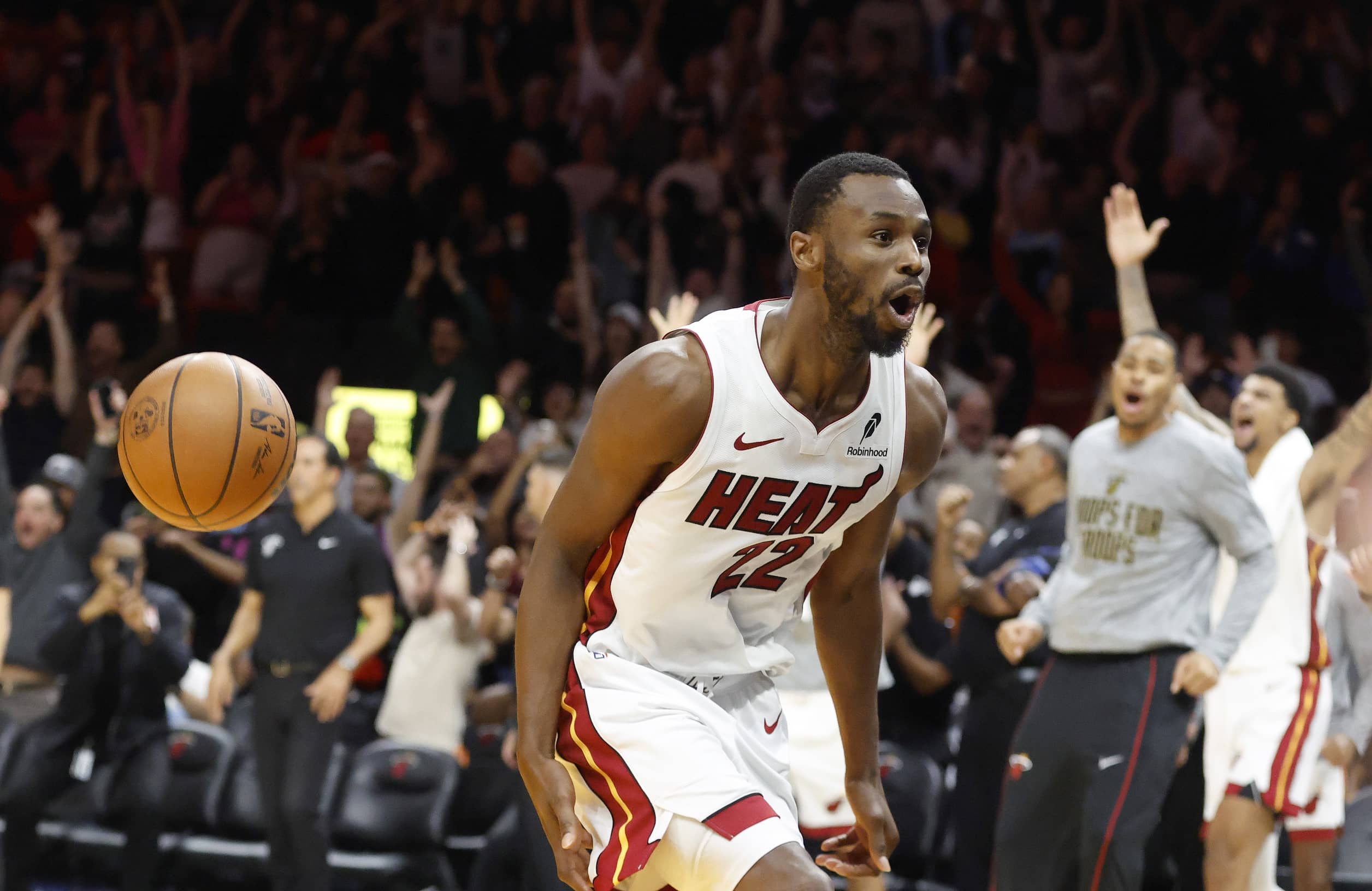 Miami Heat forward Andrew Wiggins (22) reacts after he dunks to win the game against the Cleveland Cavaliers during overtime at Kaseya Center.
