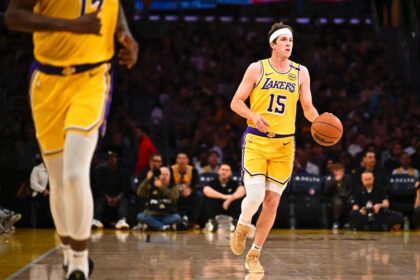 Apr 11, 2025; Los Angeles, California, USA; Los Angeles Lakers guard Austin Reaves (15) moves the ball against the Houston Rockets during the first half at Crypto.com Arena. Mandatory Credit: Jonathan Hui-Imagn Images