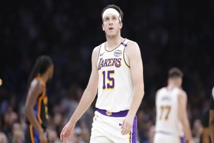 Apr 6, 2025; Oklahoma City, Oklahoma, USA; Los Angeles Lakers guard Austin Reaves (15) looks down court against the Oklahoma City Thunder during the second quarter at Paycom Center. Mandatory Credit: Alonzo Adams-Imagn Images