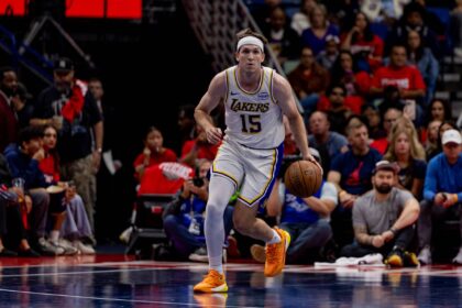 Los Angeles Lakers guard Austin Reaves (15) brings the ball up court against the New Orleans Pelicans during the first half at Smoothie King Center. Mandatory Credit: Stephen Lew-Imagn Images