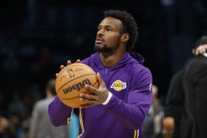 Los Angeles Lakers guard Bronny James (9) warms up prior to the game against the Charlotte Hornets at Spectrum Center. Mandatory Credit: Brian Westerholt-Imagn Images