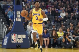 San Francisco, California, USA; Los Angeles Lakers guard Bronny James (9) dribbles upcourt against the Golden State Warriors in the first quarter at Chase Center. Mandatory Credit: David Gonzales-Imagn Images