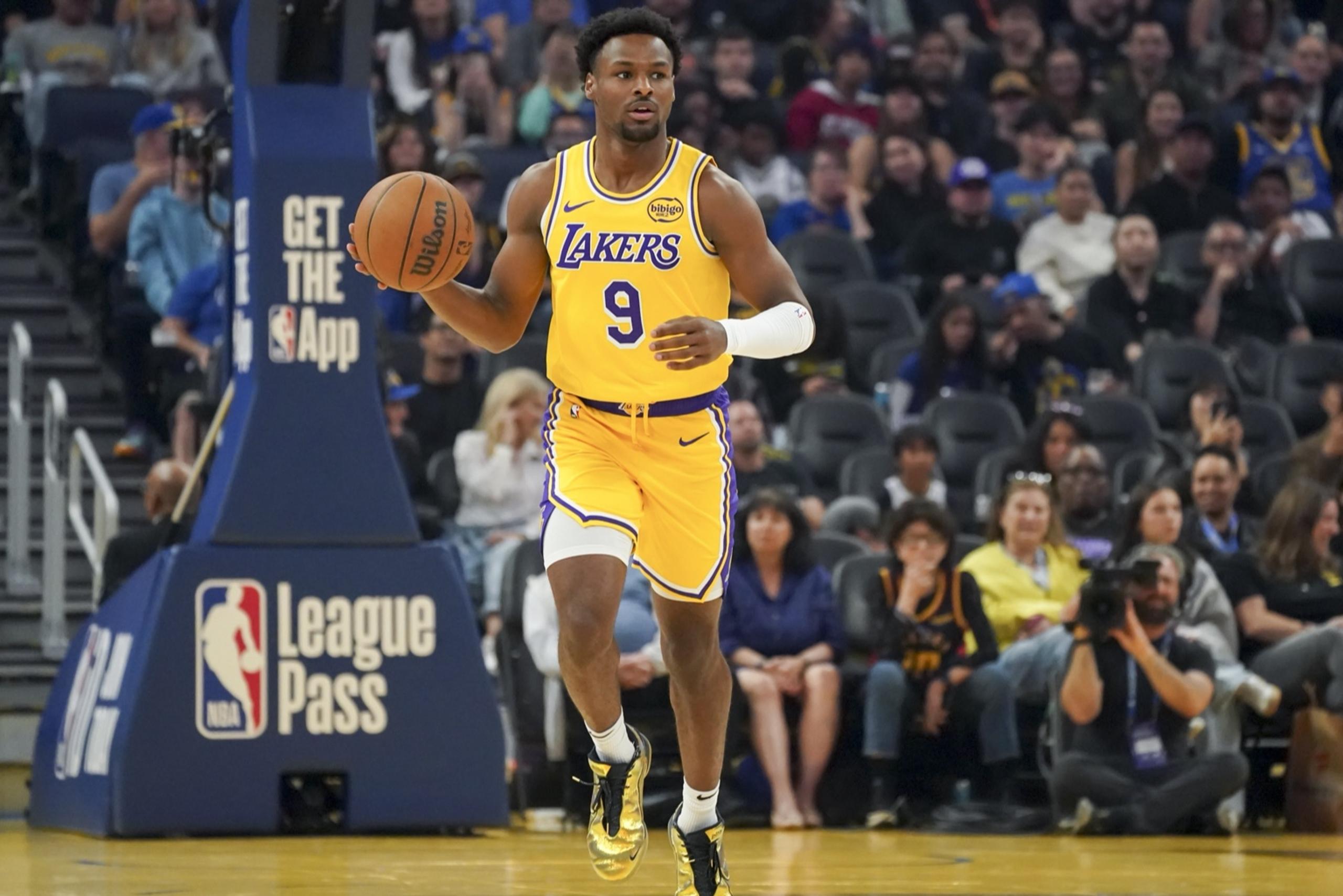 San Francisco, California, USA; Los Angeles Lakers guard Bronny James (9) dribbles upcourt against the Golden State Warriors in the first quarter at Chase Center. Mandatory Credit: David Gonzales-Imagn Images