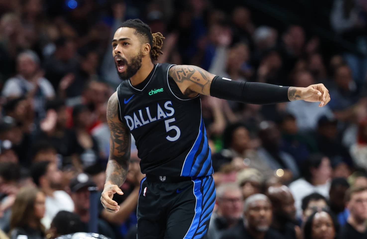 Dallas Mavericks guard D'Angelo Russell (5) reacts after scoring during the second half against the Portland Trail Blazers at American Airlines Center.