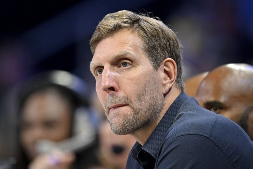 Former NBA player Dirk Nowitzki watches the game between the Dallas Wings and the Seattle Storm during the first half at College Park Center.
