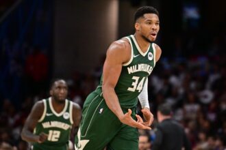 Cleveland, Ohio, USA; Milwaukee Bucks forward Giannis Antetokounmpo (34) celebrates after hitting a three point basket against the Cleveland Cavaliers during the second half at Rocket Arena. Mandatory Credit: Ken Blaze-Imagn Images