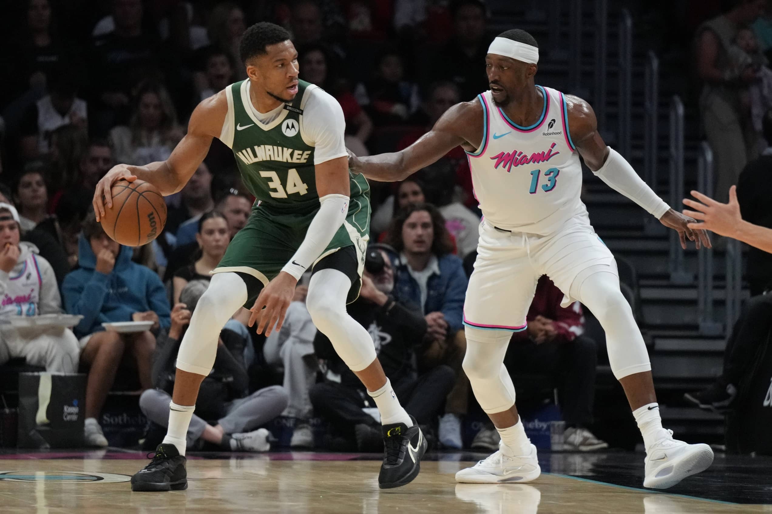Milwaukee Bucks forward Giannis Antetokounmpo (34) looks to shoot as Miami Heat center Bam Adebayo (13) defends during the first half at Kaseya Center.