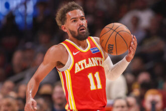 Oct 22, 2025; Atlanta, Georgia, USA; Atlanta Hawks guard Trae Young (11) dribbles against the Toronto Raptors in the first quarter at State Farm Arena. Mandatory Credit: Brett Davis-Imagn Images