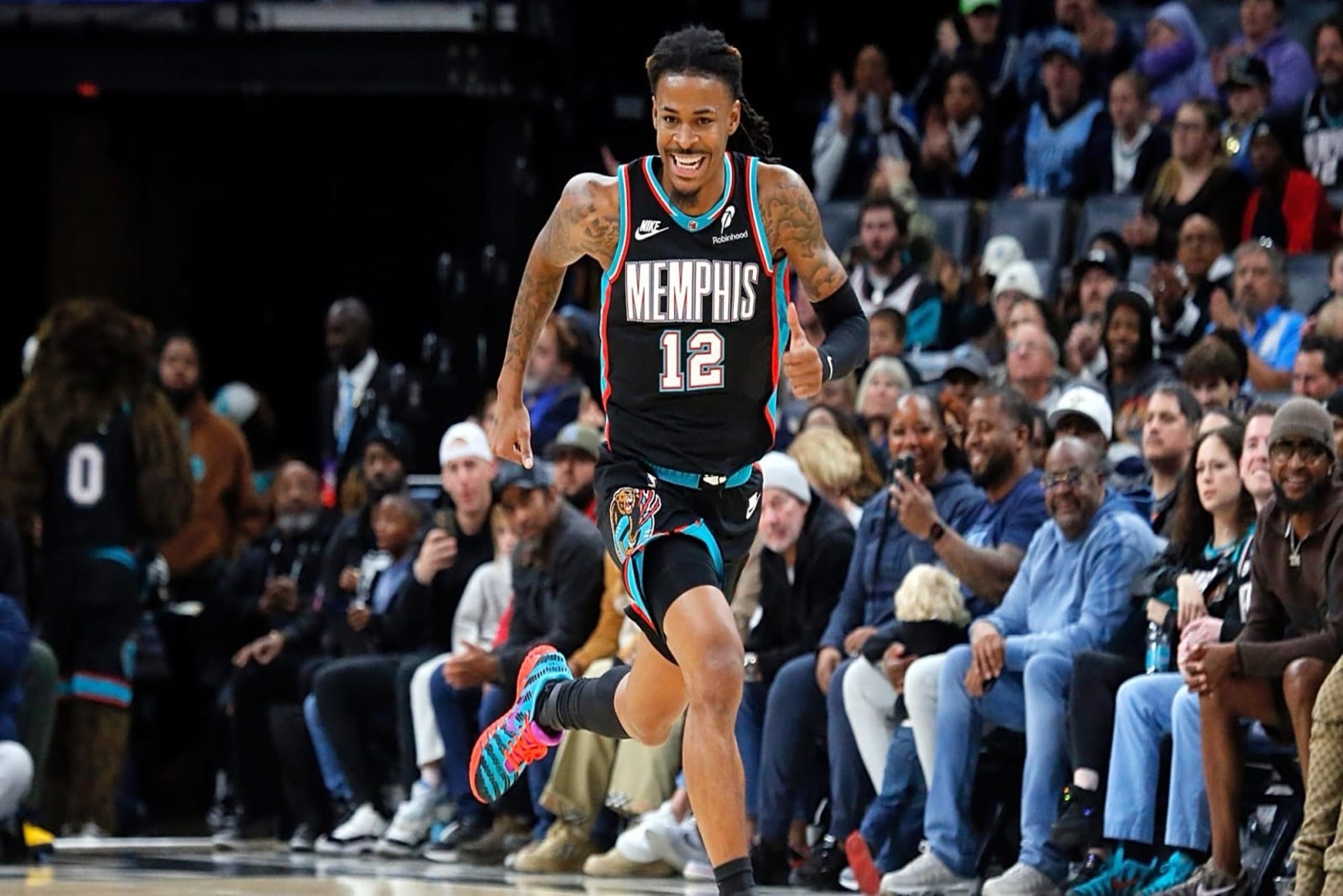 Nov 9, 2025; Memphis, Tennessee, USA; Memphis Grizzlies guard Ja Morant (12) reacts after a basket during the second quarter against the Oklahoma City Thunder at FedExForum. Mandatory Credit: Petre Thomas-Imagn Images