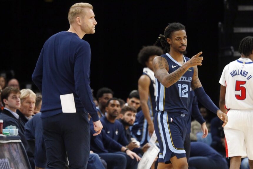 Nov 3, 2025; Memphis, Tennessee, USA; Memphis Grizzlies guard Ja Morant (12) checks into the game during the third quarter against the Detroit Pistons at FedExForum. Mandatory Credit: Petre Thomas-Imagn Images